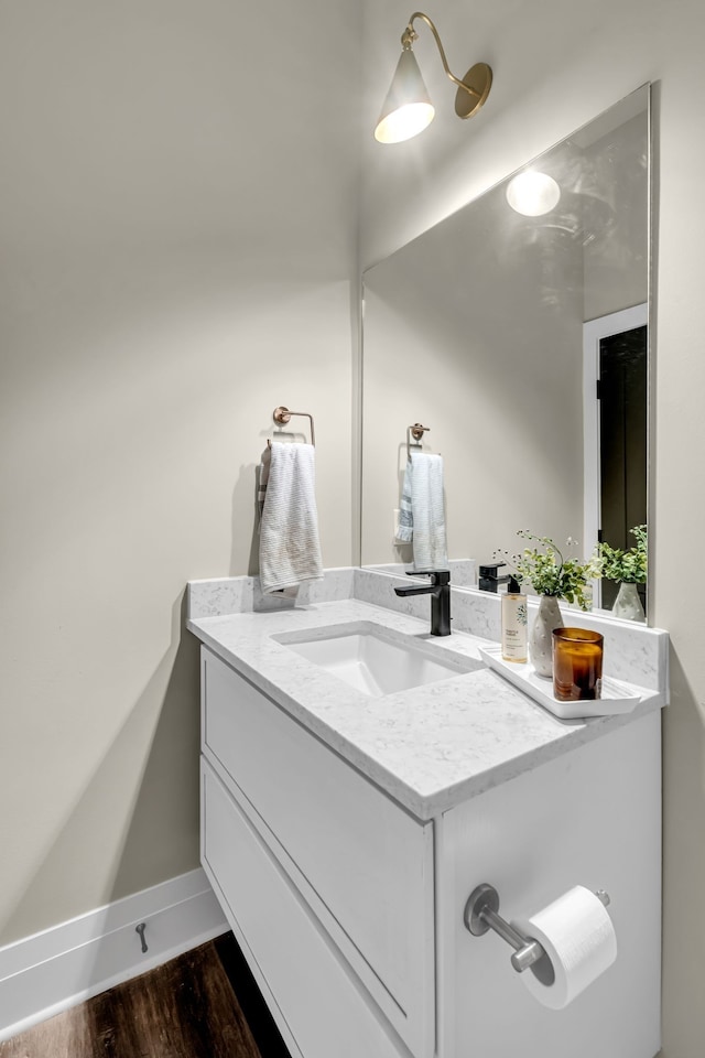 bathroom featuring hardwood / wood-style floors and vanity