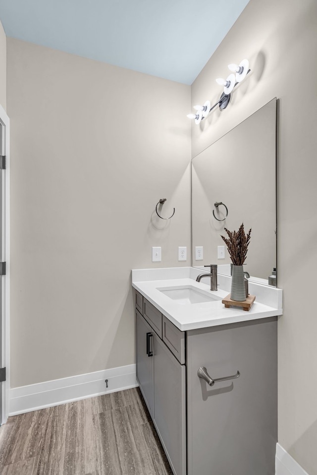 bathroom featuring wood-type flooring and vanity