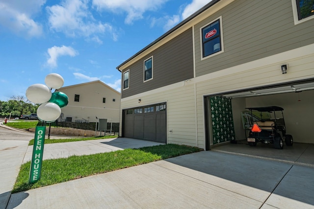 view of side of property with a garage