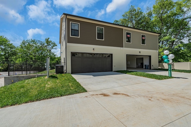 view of front of house featuring cooling unit and a garage