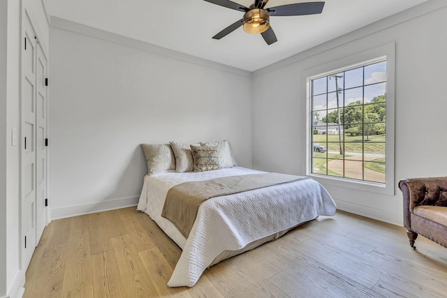 bedroom featuring ceiling fan and light hardwood / wood-style floors