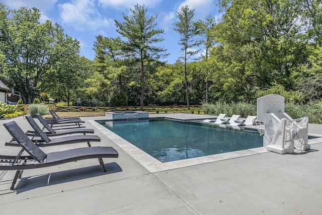 view of swimming pool with a patio