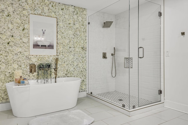 bathroom with tile patterned flooring and separate shower and tub