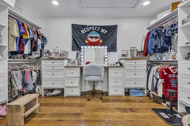 walk in closet featuring light hardwood / wood-style floors