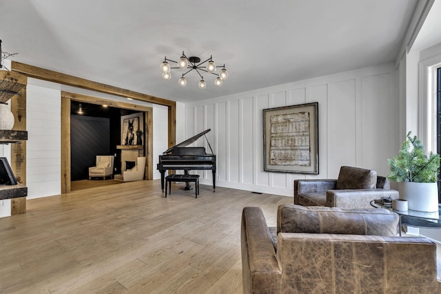 living area with a fireplace and light wood-type flooring