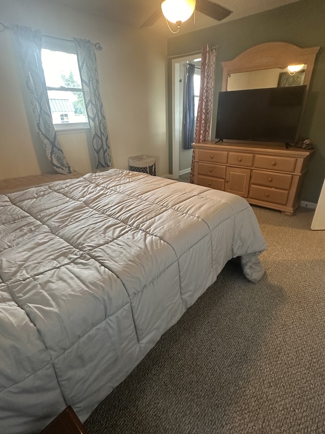 bedroom with light carpet and ceiling fan