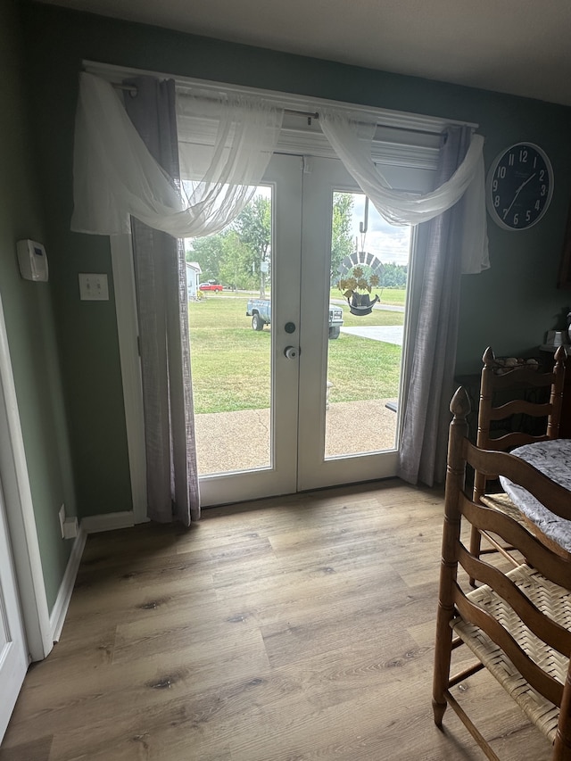 doorway featuring light wood-type flooring and french doors