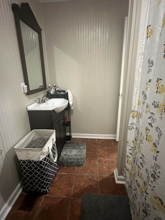 bathroom with tile patterned floors and vanity