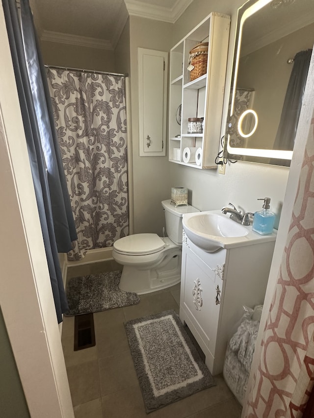 bathroom featuring vanity, crown molding, toilet, and tile patterned floors