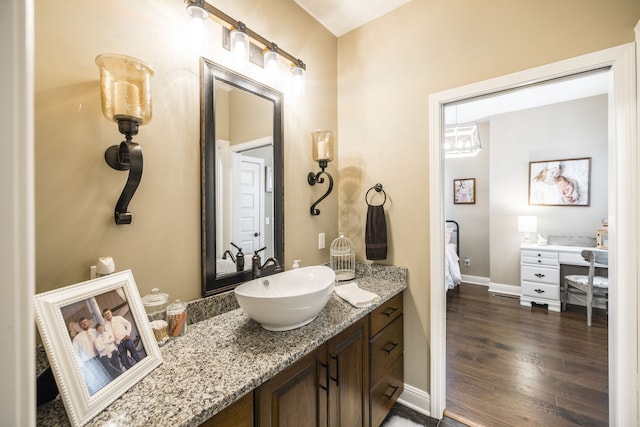 bathroom featuring vanity and wood-type flooring