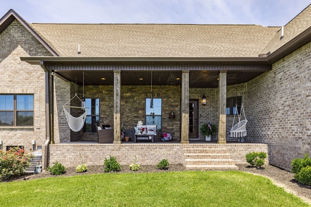 property entrance featuring a lawn