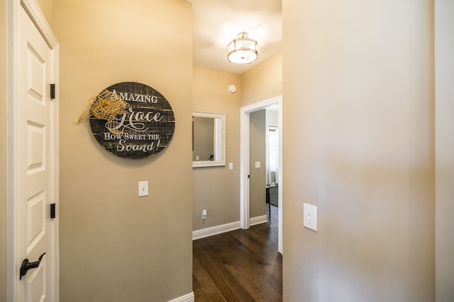 hall with dark wood-type flooring