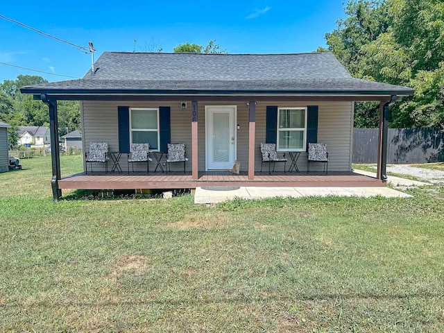 view of front facade with covered porch and a front lawn