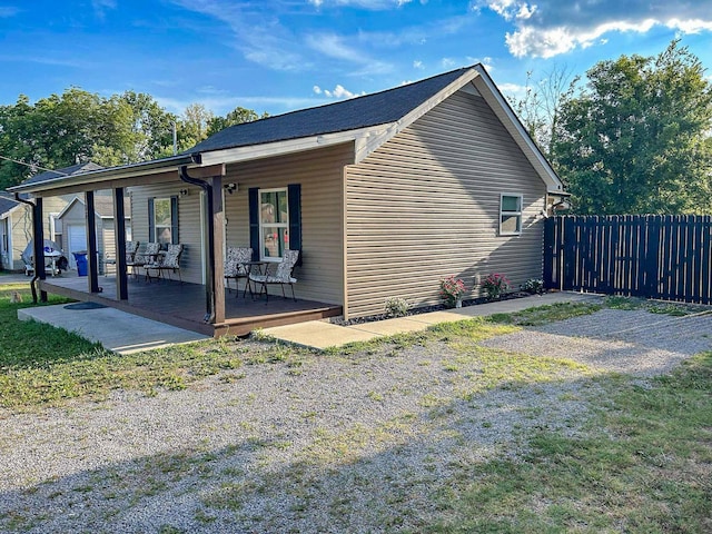 view of side of home with a yard