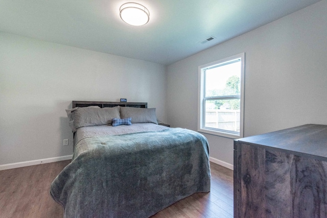 bedroom featuring dark hardwood / wood-style floors