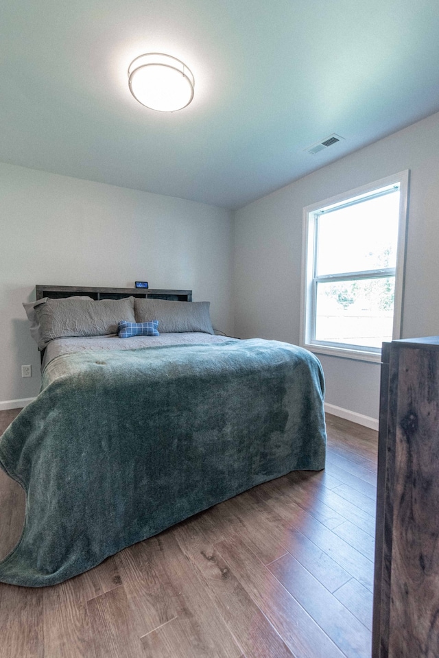 bedroom with wood-type flooring