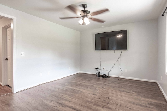 unfurnished living room with ceiling fan and hardwood / wood-style flooring