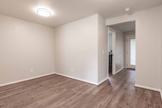 empty room with wood-type flooring