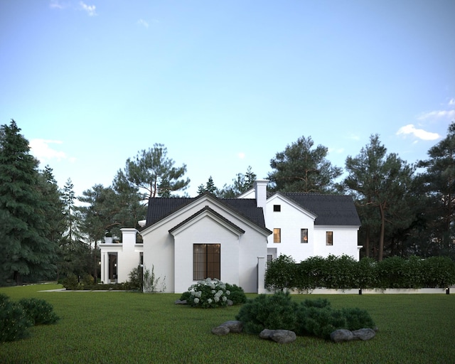 modern farmhouse featuring a chimney and a front lawn