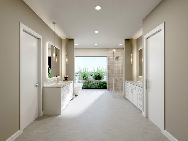 full bathroom featuring a freestanding bath, recessed lighting, a stall shower, and vanity