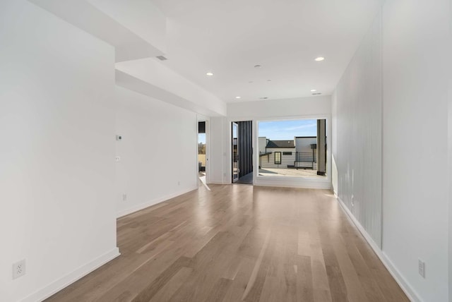 interior space with recessed lighting, baseboards, and light wood-style floors