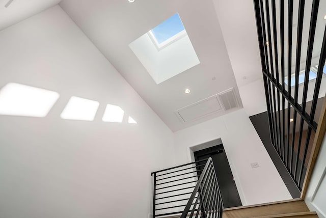 stairway with vaulted ceiling