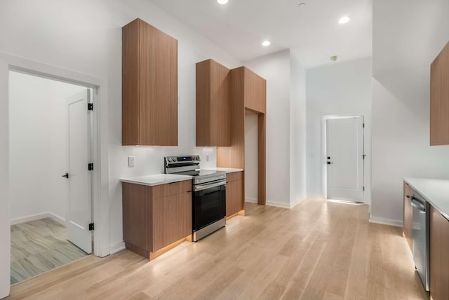 kitchen featuring light countertops, modern cabinets, and stainless steel appliances