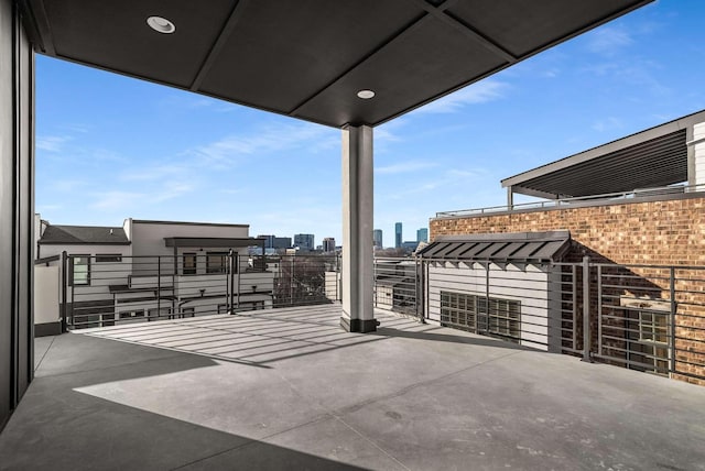 view of patio / terrace featuring a city view and a balcony