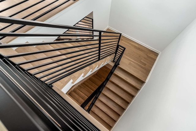 staircase featuring wood finished floors