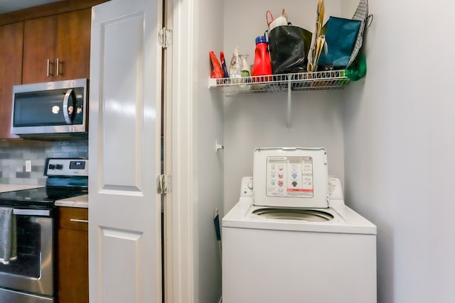 washroom featuring washer / clothes dryer