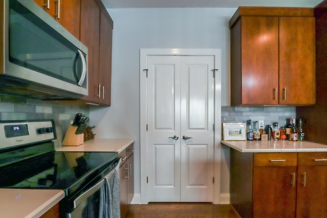 kitchen featuring backsplash and stainless steel appliances