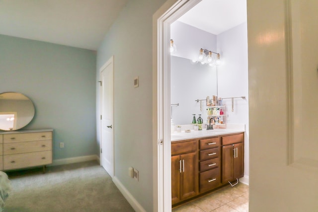 bathroom with tile patterned flooring and double vanity