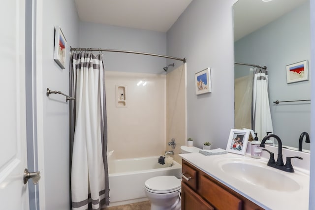 full bathroom with toilet, vanity, and shower / tub combo with curtain