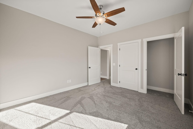 unfurnished bedroom featuring ceiling fan and carpet flooring