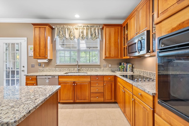 kitchen with sink, light tile patterned floors, black appliances, crown molding, and light stone countertops