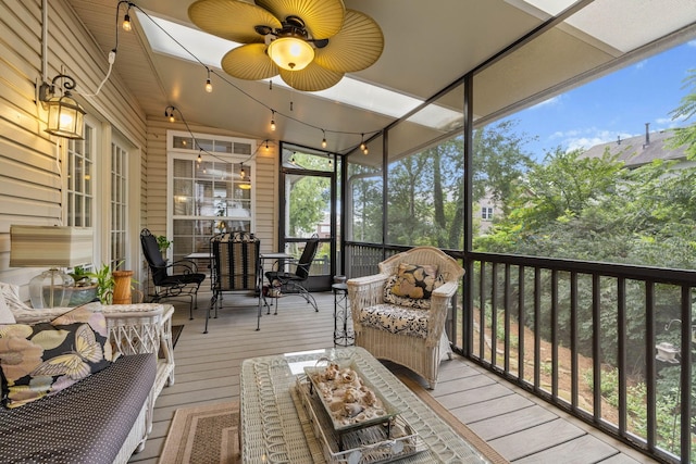 sunroom / solarium featuring ceiling fan