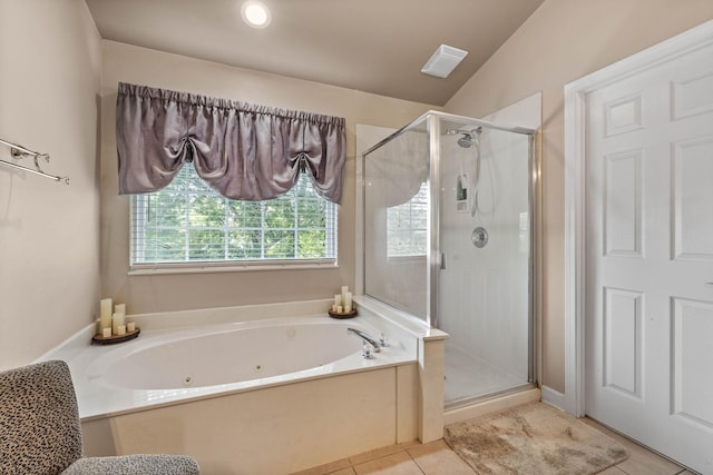 bathroom featuring tile patterned flooring, lofted ceiling, and independent shower and bath