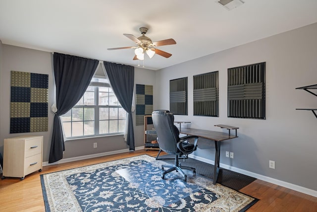 office area with ceiling fan and light wood-type flooring