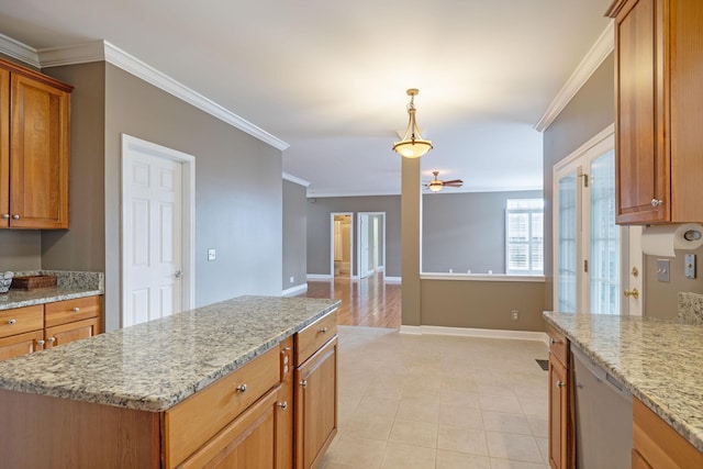 kitchen featuring crown molding, dishwasher, a kitchen island, pendant lighting, and light stone countertops