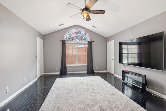 unfurnished living room featuring lofted ceiling, dark hardwood / wood-style floors, and ceiling fan