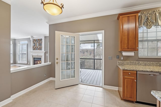 doorway with ornamental molding and light tile patterned floors