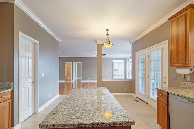 kitchen with ornamental molding, light stone countertops, a center island, and stainless steel dishwasher