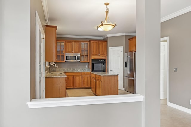 kitchen with stainless steel appliances, crown molding, hanging light fixtures, and sink