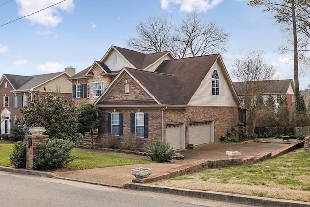 view of front of property featuring a garage and a front yard