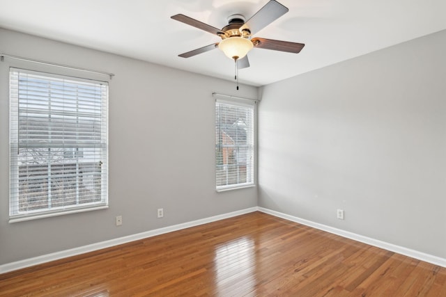 unfurnished room featuring hardwood / wood-style flooring and ceiling fan