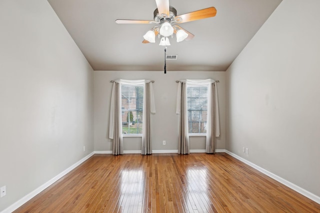 spare room with light hardwood / wood-style floors and ceiling fan