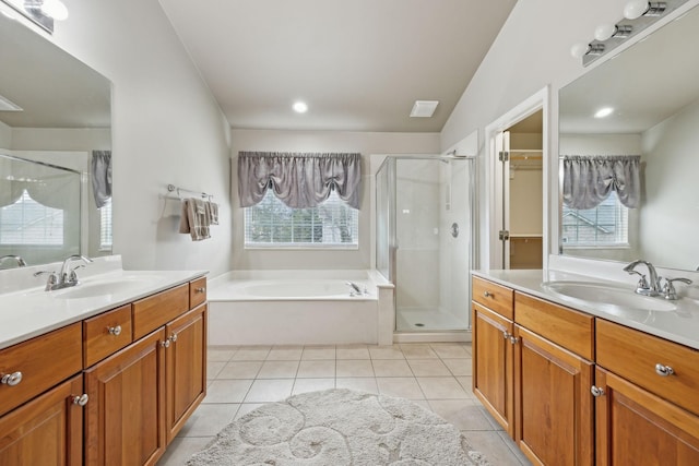 bathroom featuring tile patterned flooring, vanity, and independent shower and bath