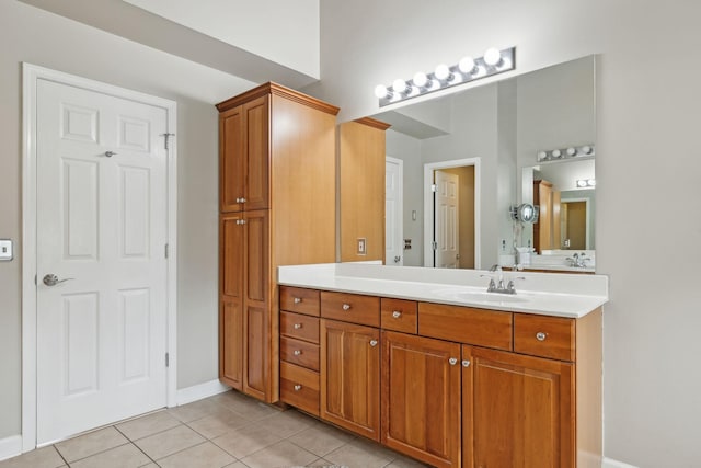 bathroom with tile patterned flooring and vanity