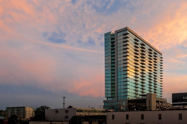 view of outdoor building at dusk