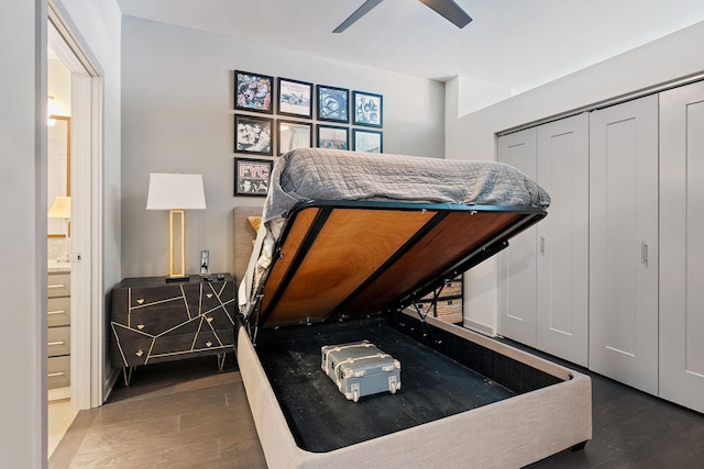 bedroom featuring ceiling fan, ensuite bath, and dark hardwood / wood-style floors